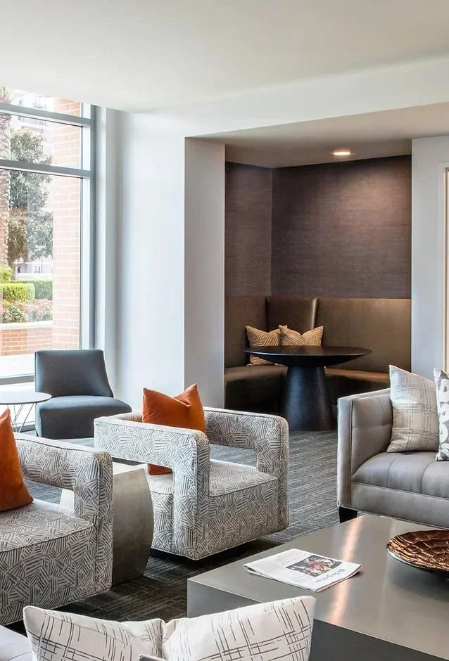 Multifamily amenity space interior design in Houston with tailored lounge seating, refined materials and a luxury residential-style finish