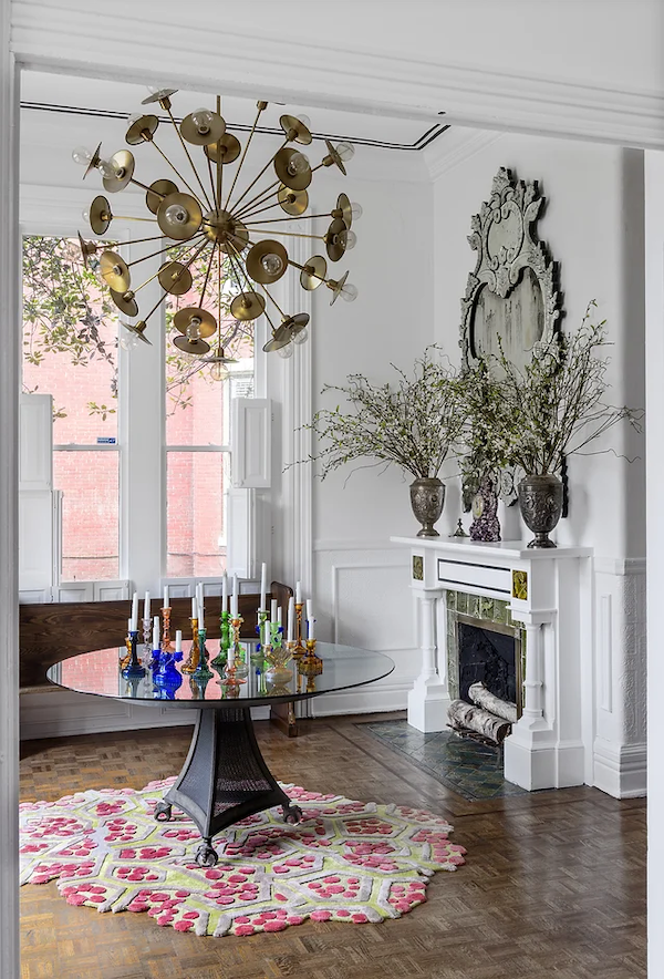 High end dining room interior design Houston with statement lighting and bespoke marble table